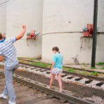 Kids walking on Railroad Tracks
